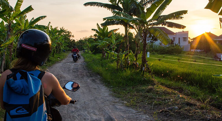 Woman drives Canggu area Bali Indonesia